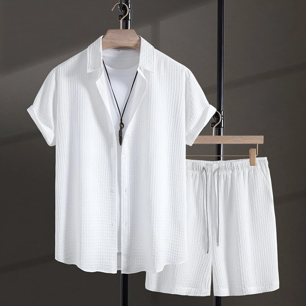 Men's black cotton blend beach suit with loose cardigan shirt and matching shorts.
