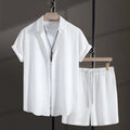 Men's black cotton blend beach suit with loose cardigan shirt and matching shorts.