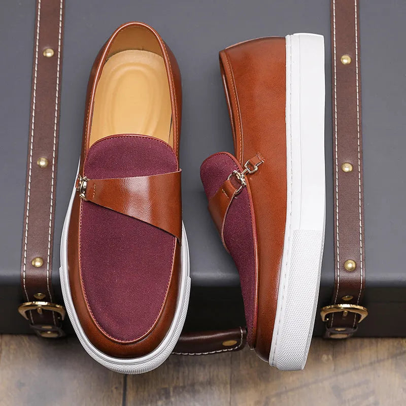Men's black faux leather slip-on loafers featuring a gold horsebit buckle and a round toe.