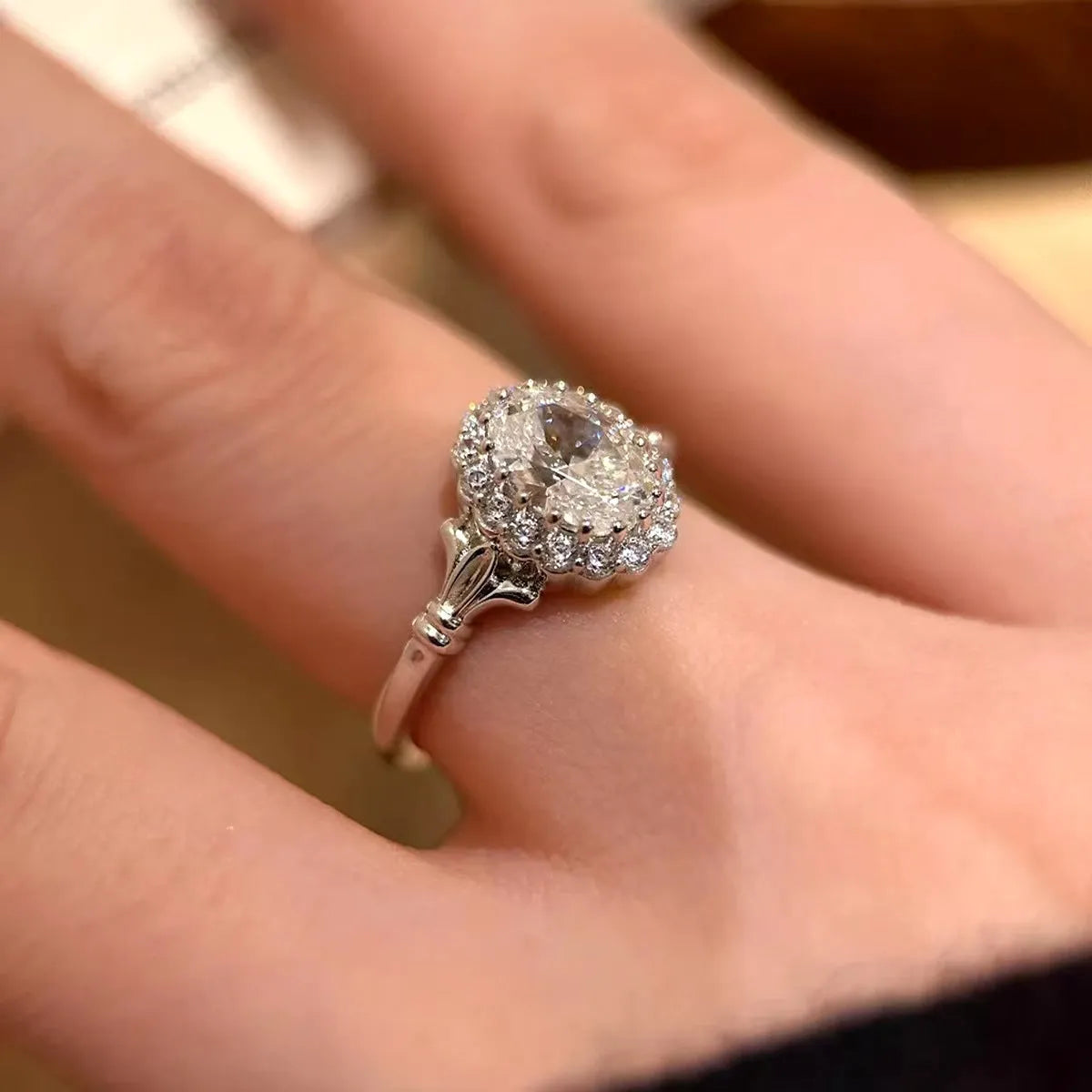Silver-coloured adjustable geometry ring with an ellipse design and diamond-treated finish.