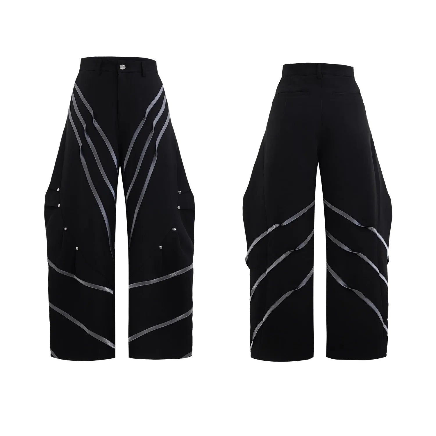 Men's black trousers with pleated detail and metal rivets, showing three-dimensional cut.