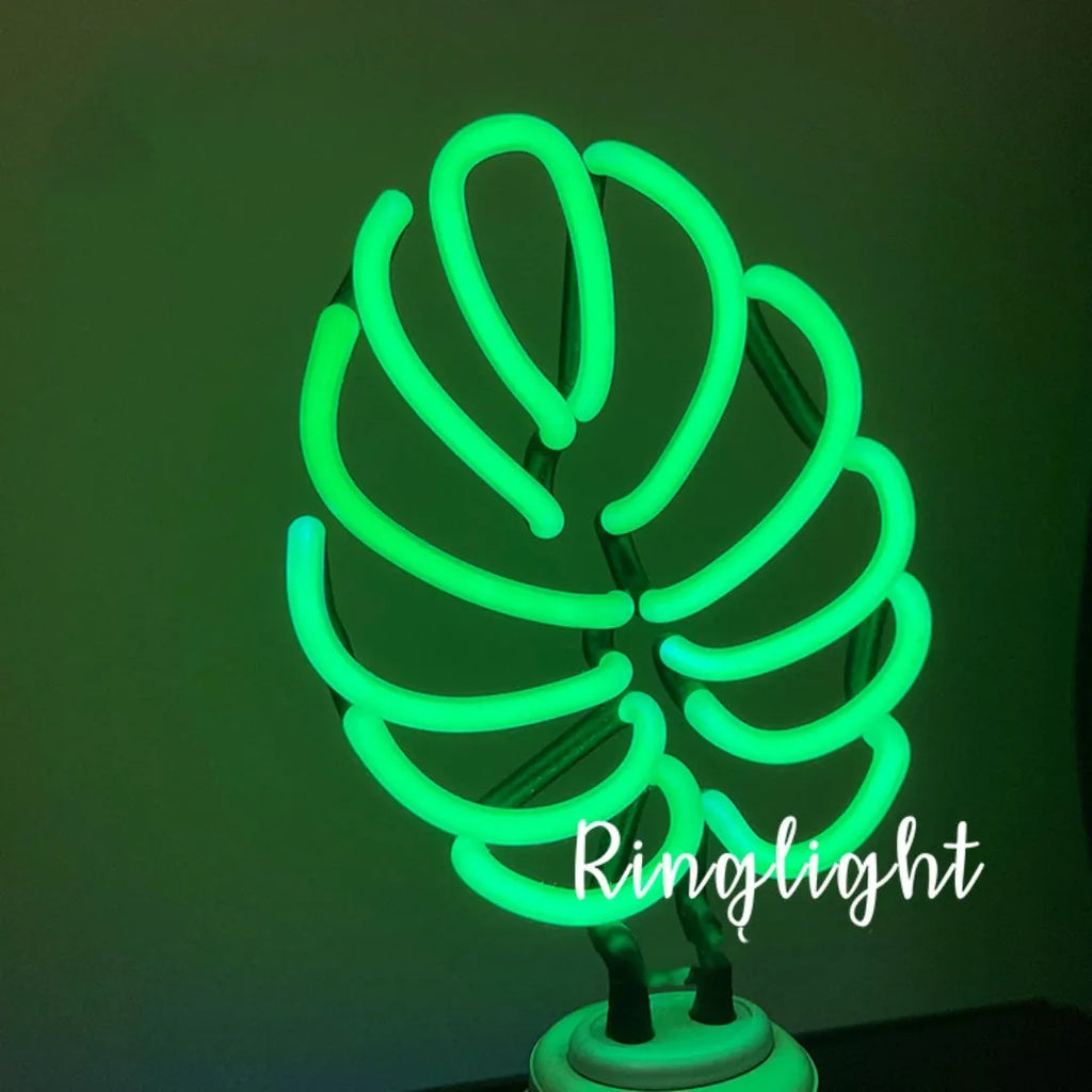 Minimalist green light bamboo desk lamp with USB plug on a wooden table.