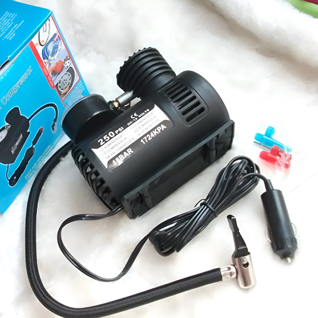 Black 12V mini portable car air pump on a white background.