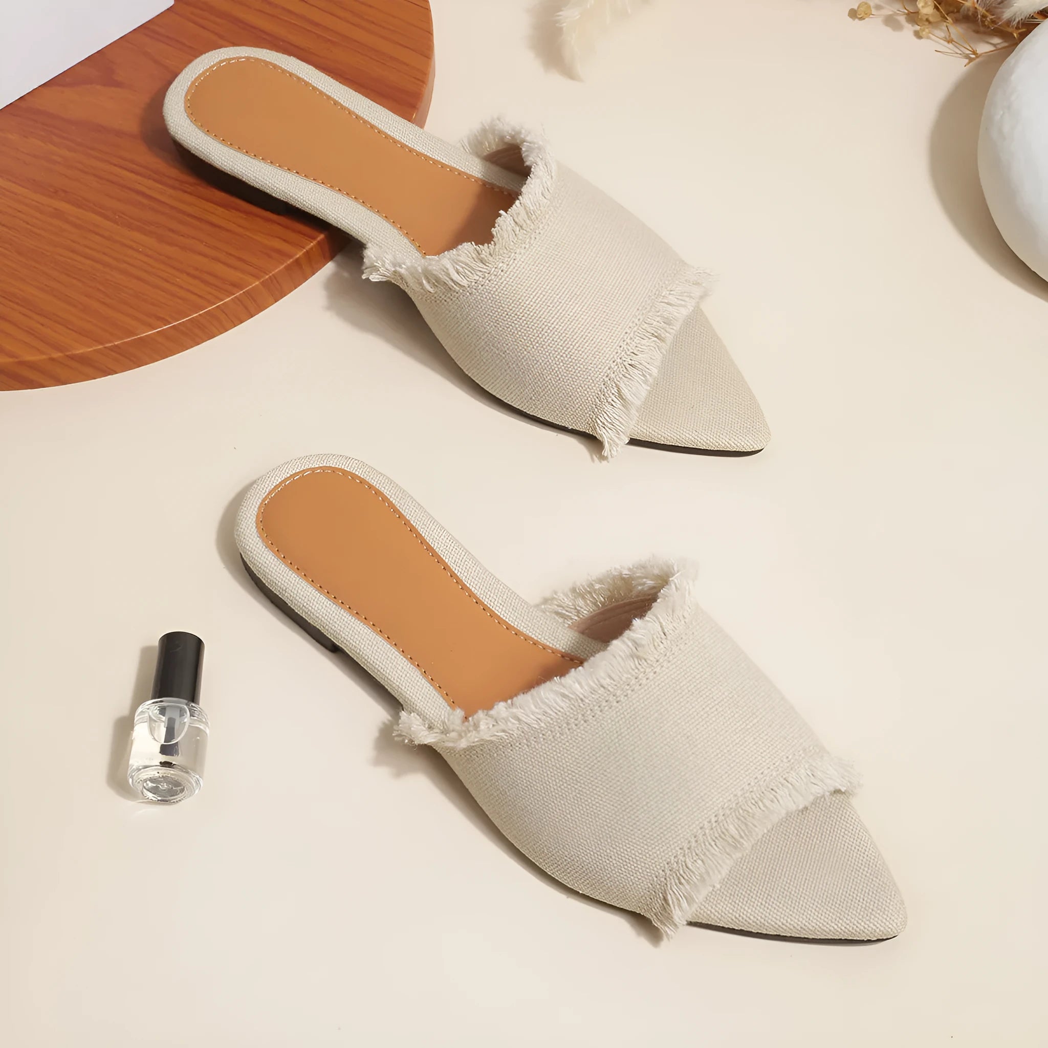Women's denim flat slippers with tassel decoration in various colours showing leather lining and PVC soles
