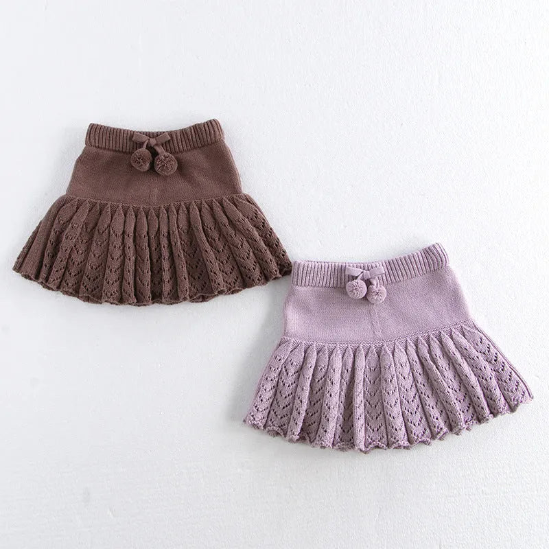 Girls hollow retro pleated pantskirt in light gray purple cotton, front view, on child of about 90cm height