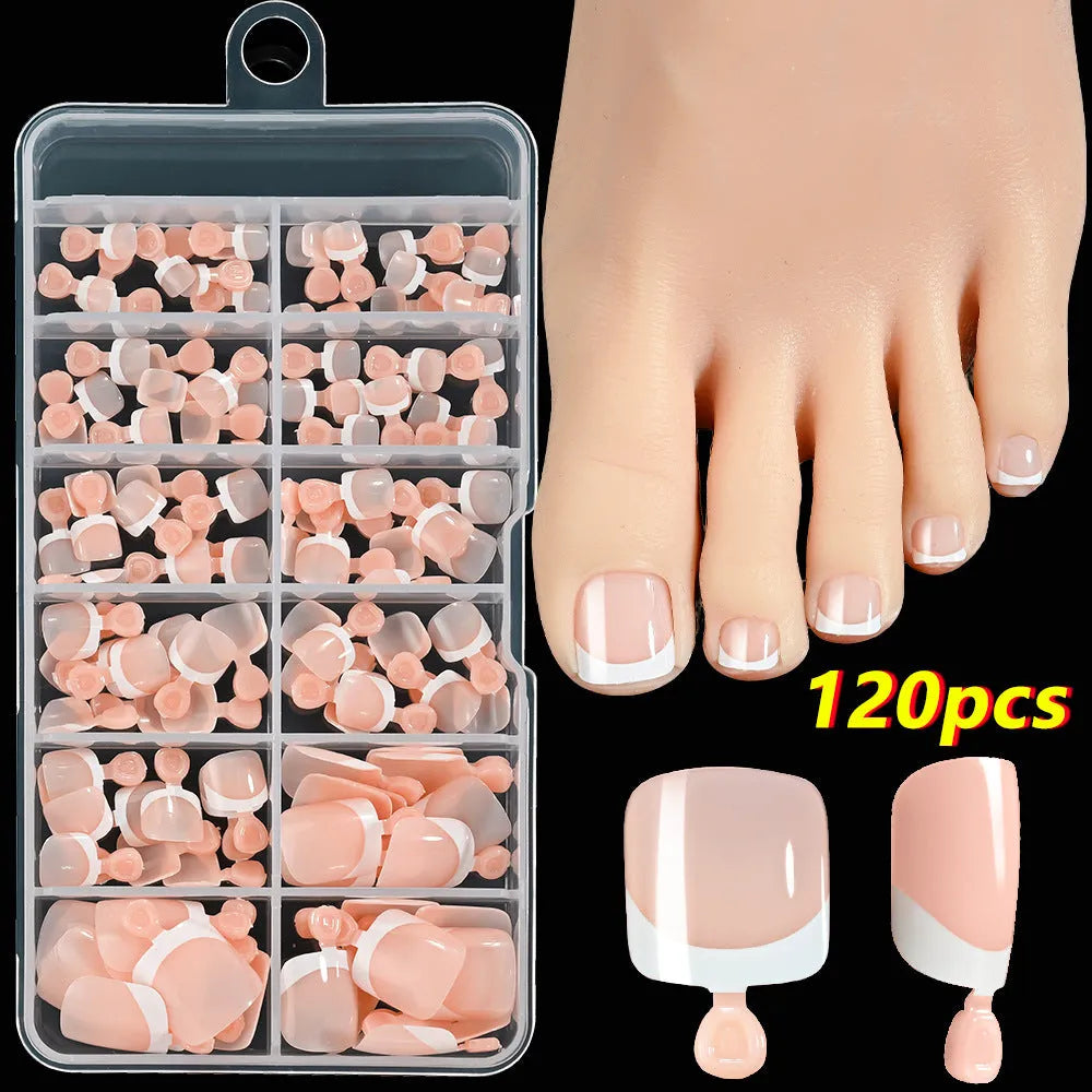 Open box showing 120 French white edge nude square false toe nail pieces in various shades.
