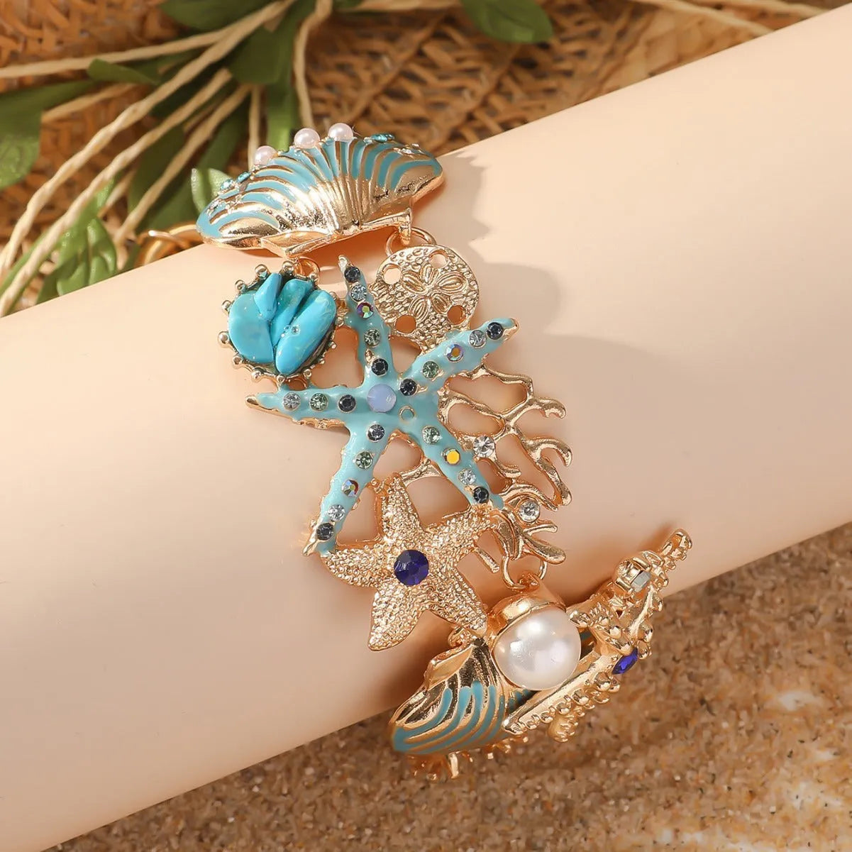 Alloy boat anchor and starfish rhinestone bracelet for women in turquoise, coral red, or coral blue.