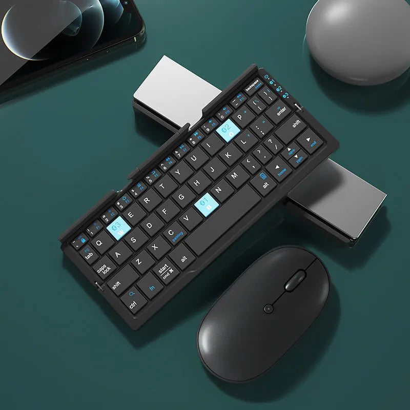 Silver white folding Bluetooth keyboard shown open with stand supporting a smartphone