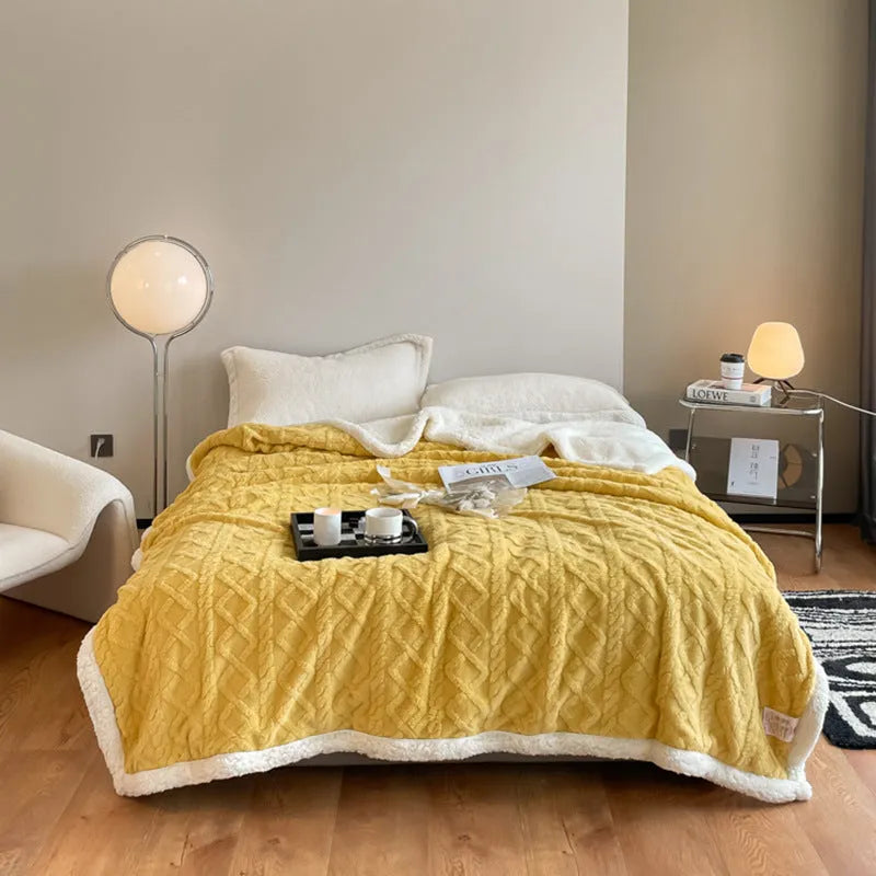 Polyester winter thermal flannel blanket in beige, laid flat showing its texture and simple modern style.