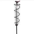 Cast iron bird-shaped rain gauge with glass measurement tube showing 1-20 scale and 800ml capacity