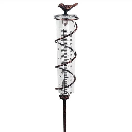 Cast iron bird-shaped rain gauge with glass measurement tube showing 1-20 scale and 800ml capacity