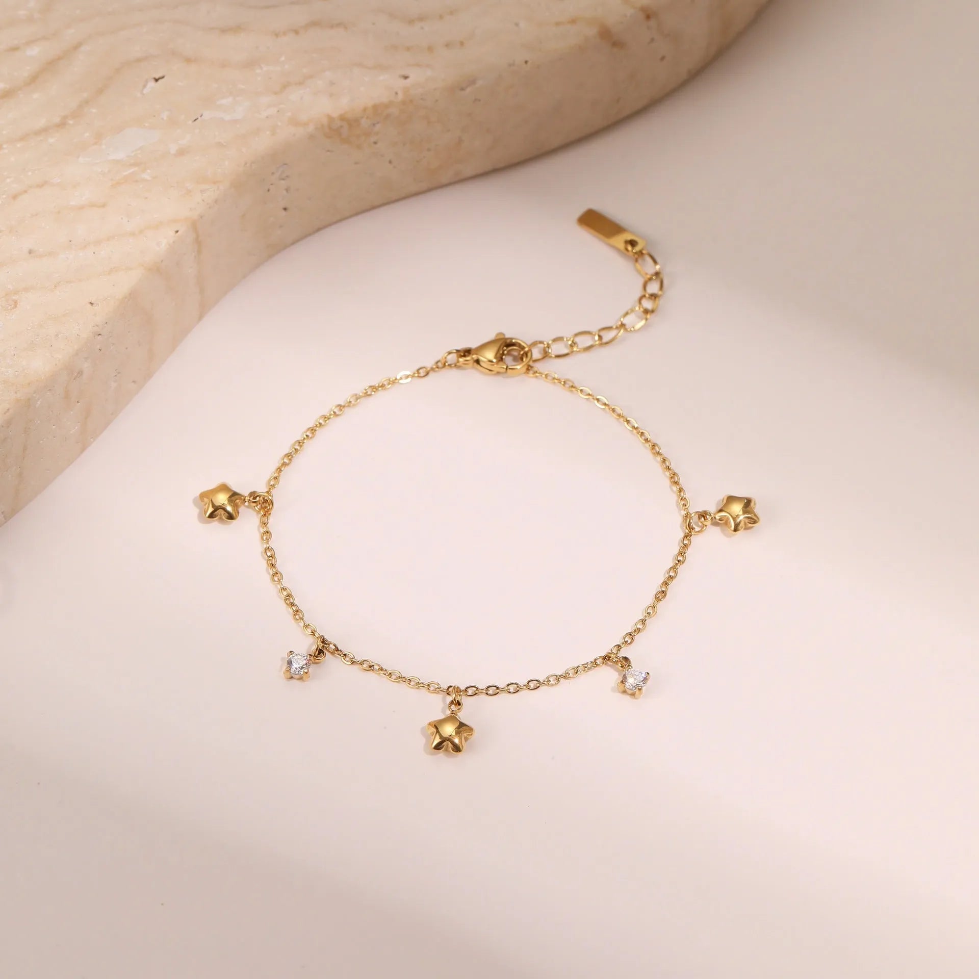 Women's stainless steel bracelet with geometric star pendant featuring hexagonal design and zircon accents