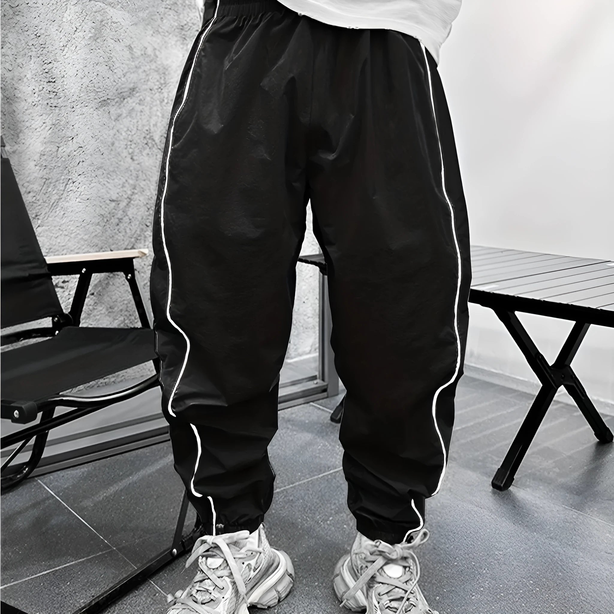 Men's blue bamboo fibre casual sports trousers with cropped length and loose fit on a hanger.