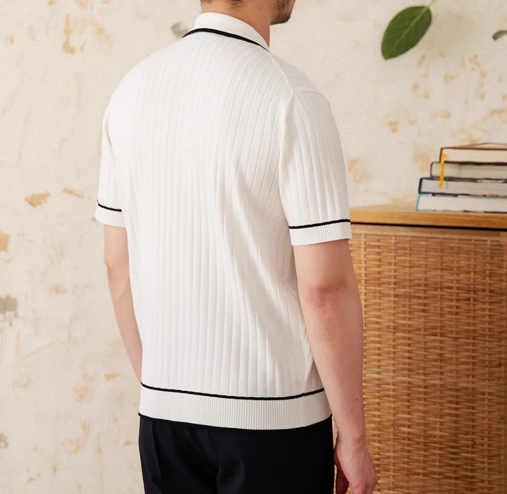 Slim fit black lapel polo shirt with short sleeves on a hanger.