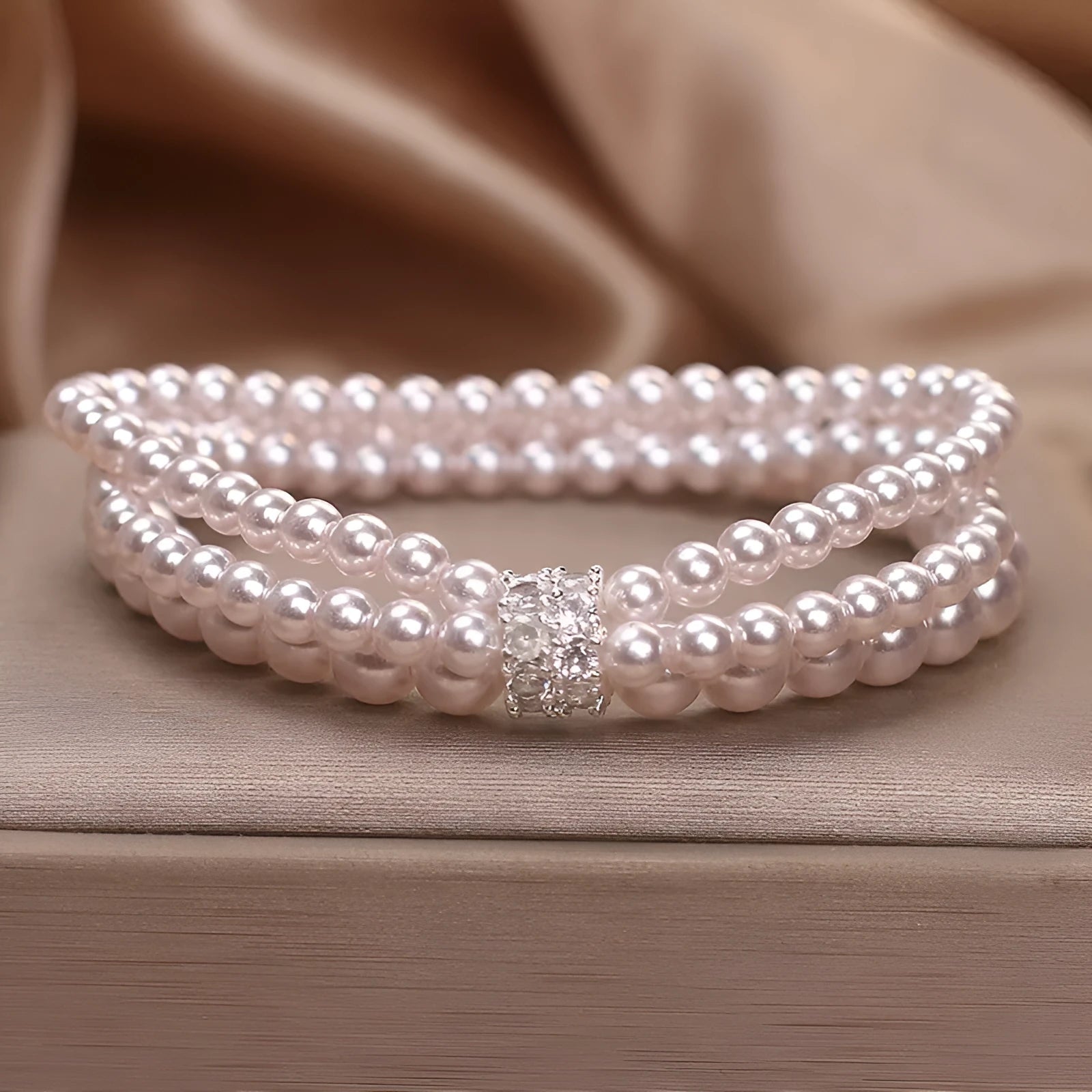 Baroque pearl multi-layer twin bracelet with pink and white imitation pearl beads on display