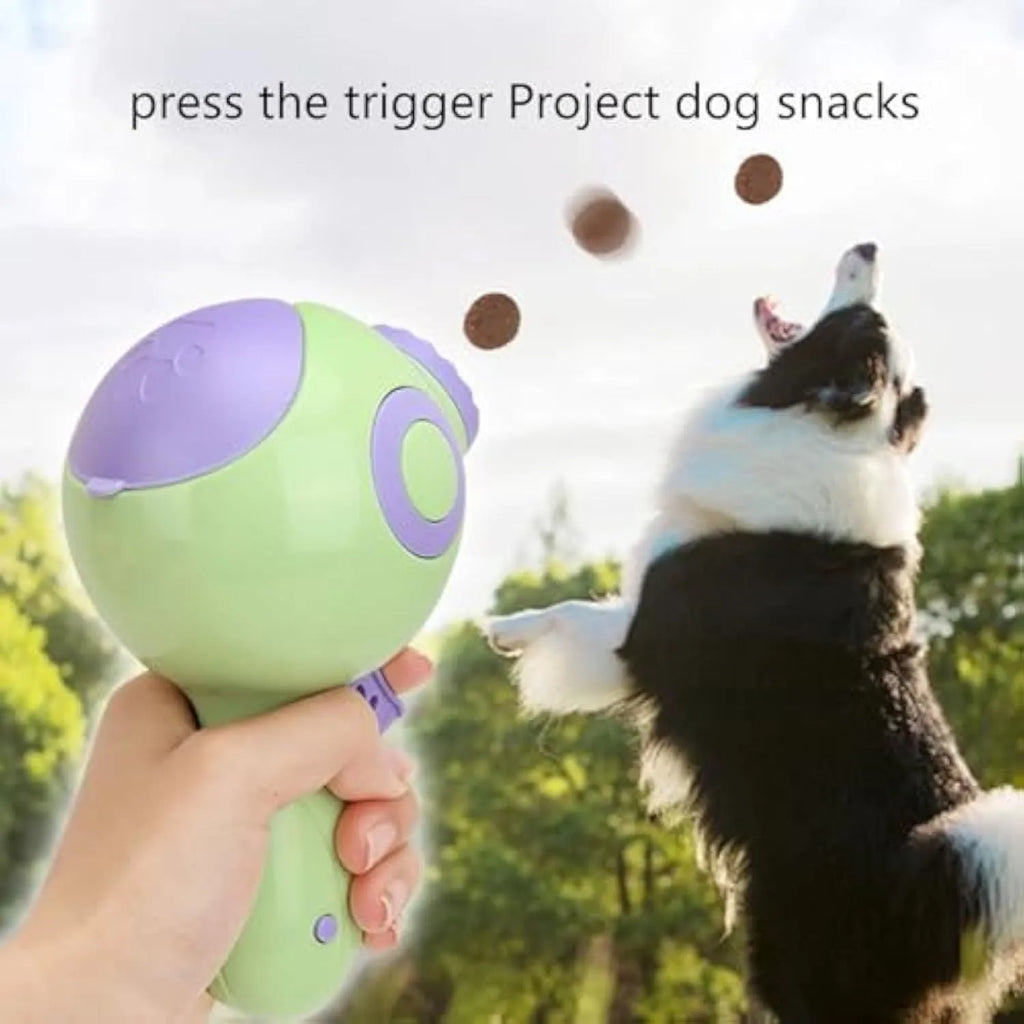 Green dog treat launcher toy for interactive pet play and remote feeding