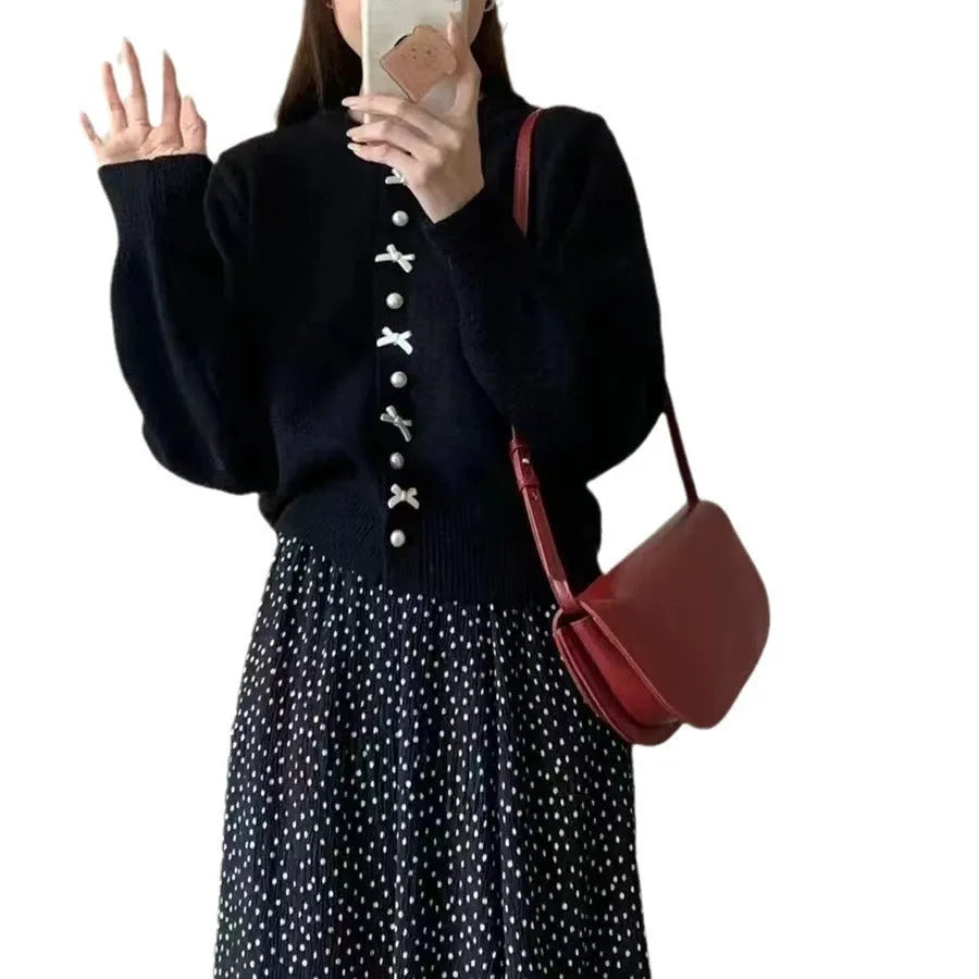 Women's cashmere cardigan sweater with bow accent and pearl buttons in nine colour options