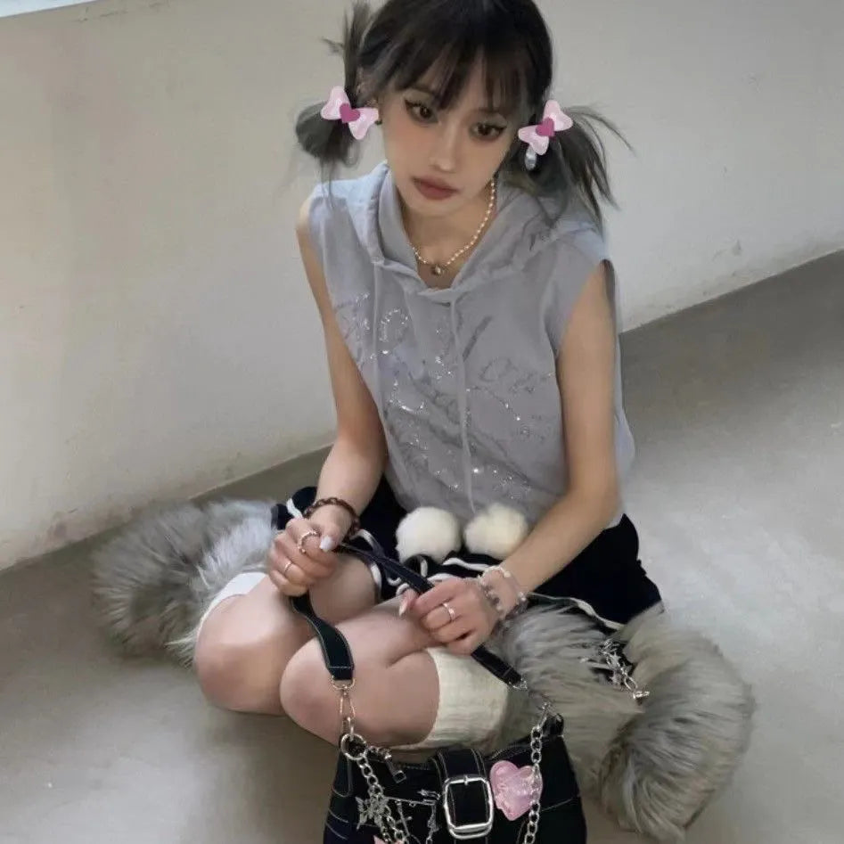 Black PU leather Y2K shoulder bag with heart butterfly shape, bow, stitching, chain, and zipper buckle