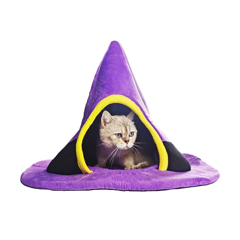 Purple cloth Halloween witch hat shaped cat bed measuring 60 by 45 centimetres.