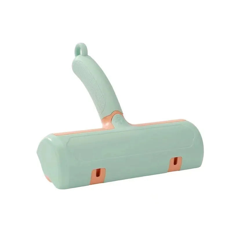 Mint green and twilight grey cat hair removal brush with two head style options on a white background.