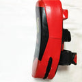 Black and red square hand-held martial arts training target pad with a buckle strap.