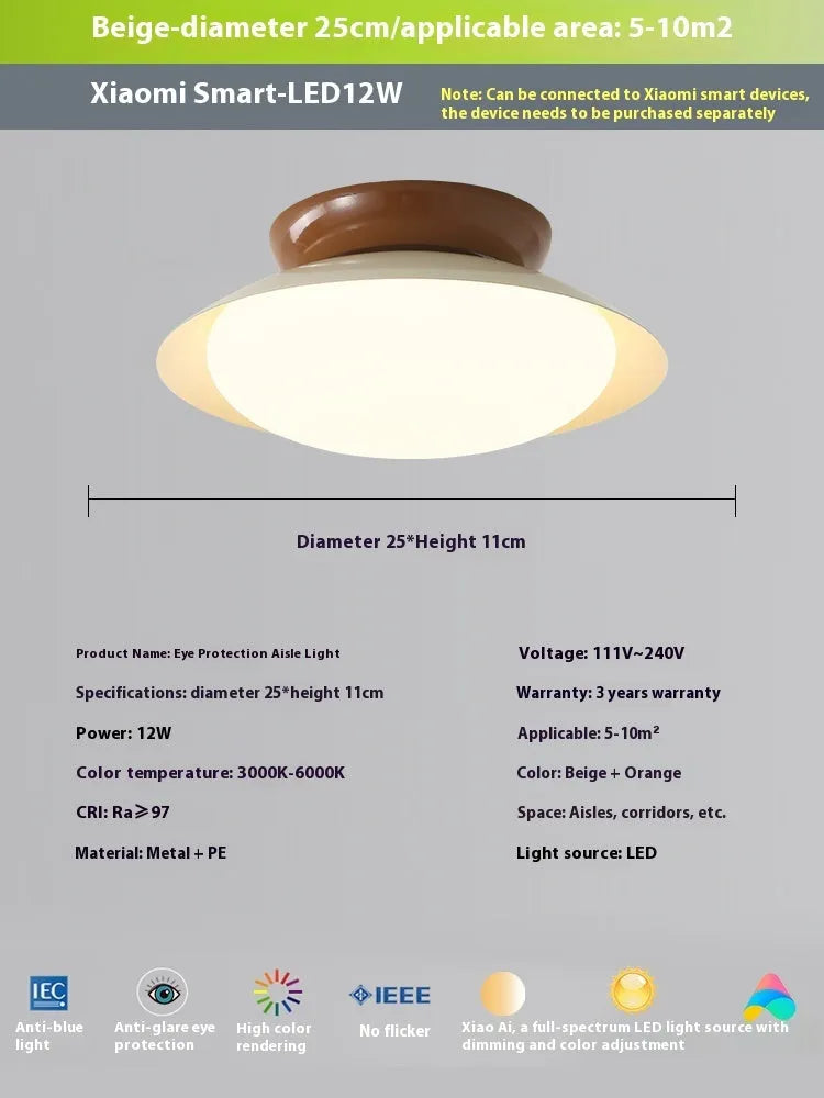 Modern cream style flying saucer shaped ceiling lamp in an iron shade.