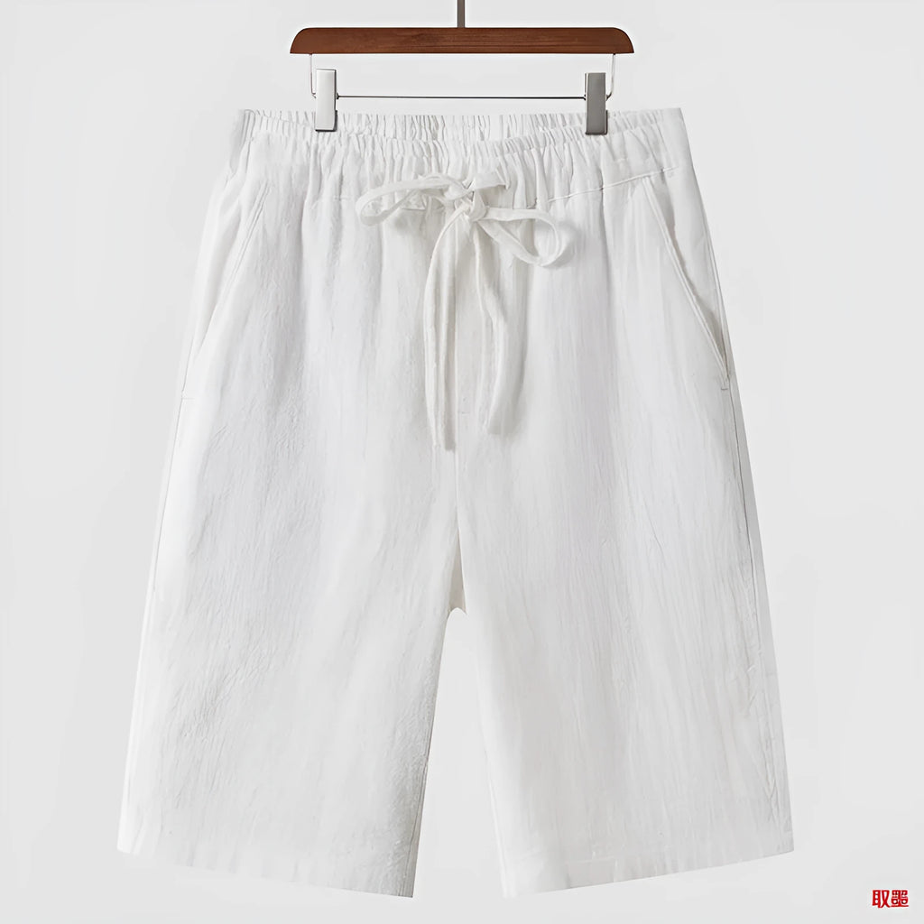 Men's linen shorts in loose cropped style with elastic waistband in various colours