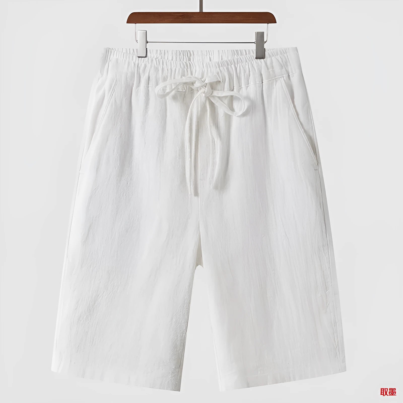 Men's linen shorts in loose cropped style with elastic waistband in various colours