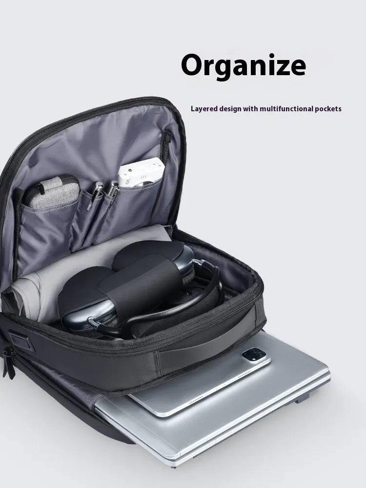 Graphite grey USB business backpack with Oxford cloth exterior showing charging port and under 20L capacity
