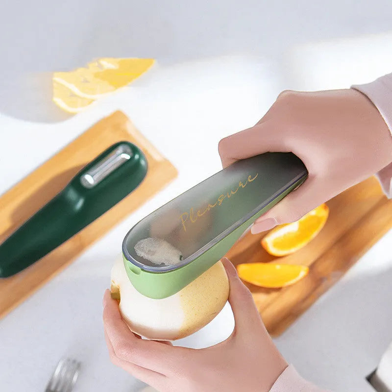 Green kitchen peeler with a stainless steel blade stored inside its transparent plastic tube.