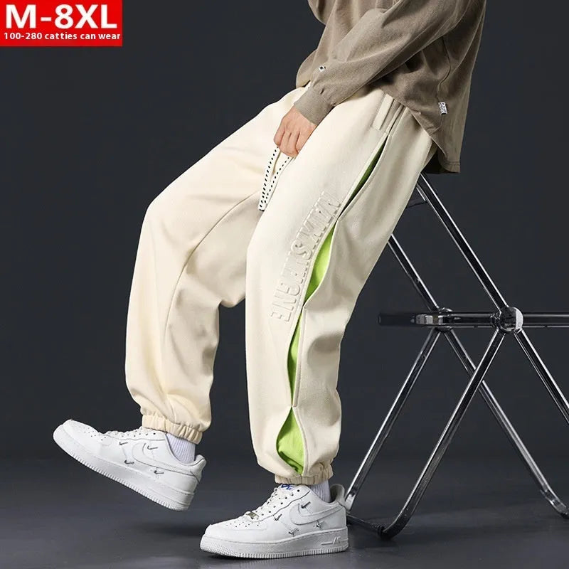 Men's loose cotton trousers with stitching detailing and ankle banding in grey green colour