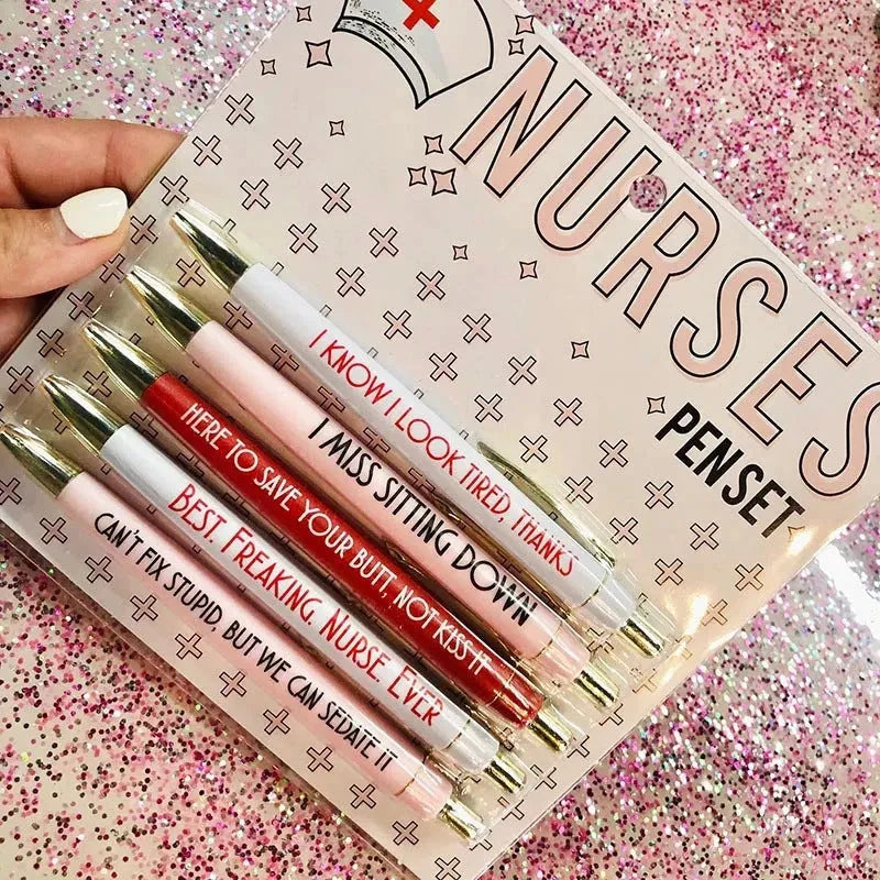 Five nurse-themed retractable ballpoint pens with humorous medical prints arranged together