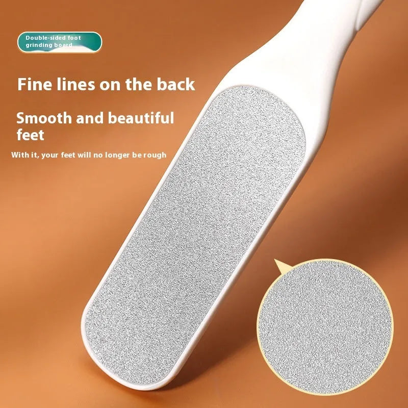 Stainless steel foot grinder file with attached sandpaper pad and separate black and white refill packs.