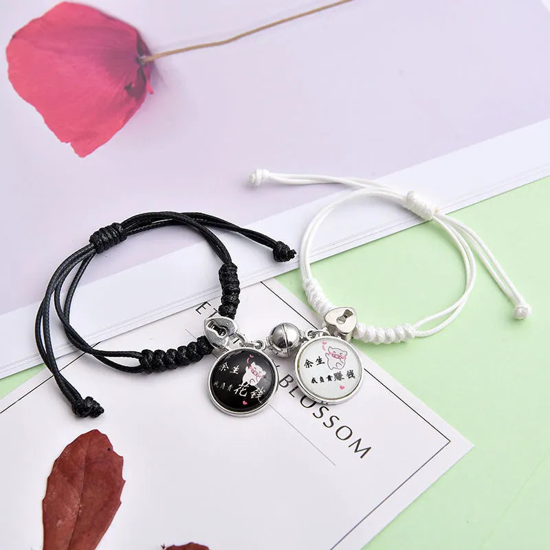 Magnet suction couple bracelets with alloy construction and various pendant designs including crowns and hearts