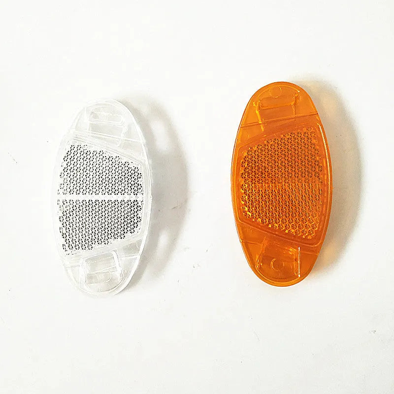 White and yellow plastic bicycle spoke reflectors for wheel safety decoration
