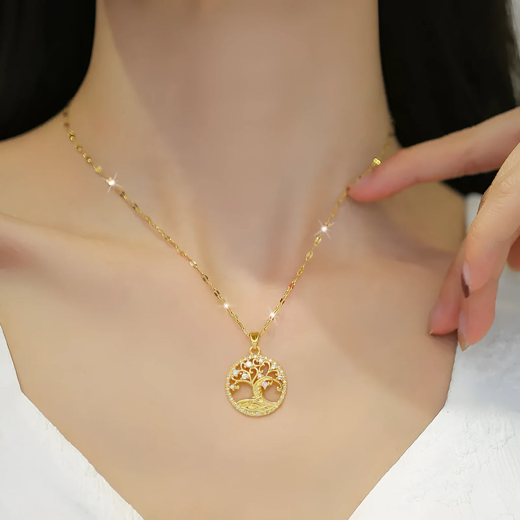 Gold-plated lucky tree necklace with rhinestone zircons and mother pearl on a stainless steel lip chain.