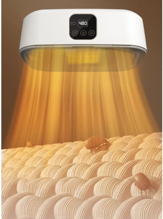 White cylindrical portable laundry drier dryer with remote control on a countertop.
