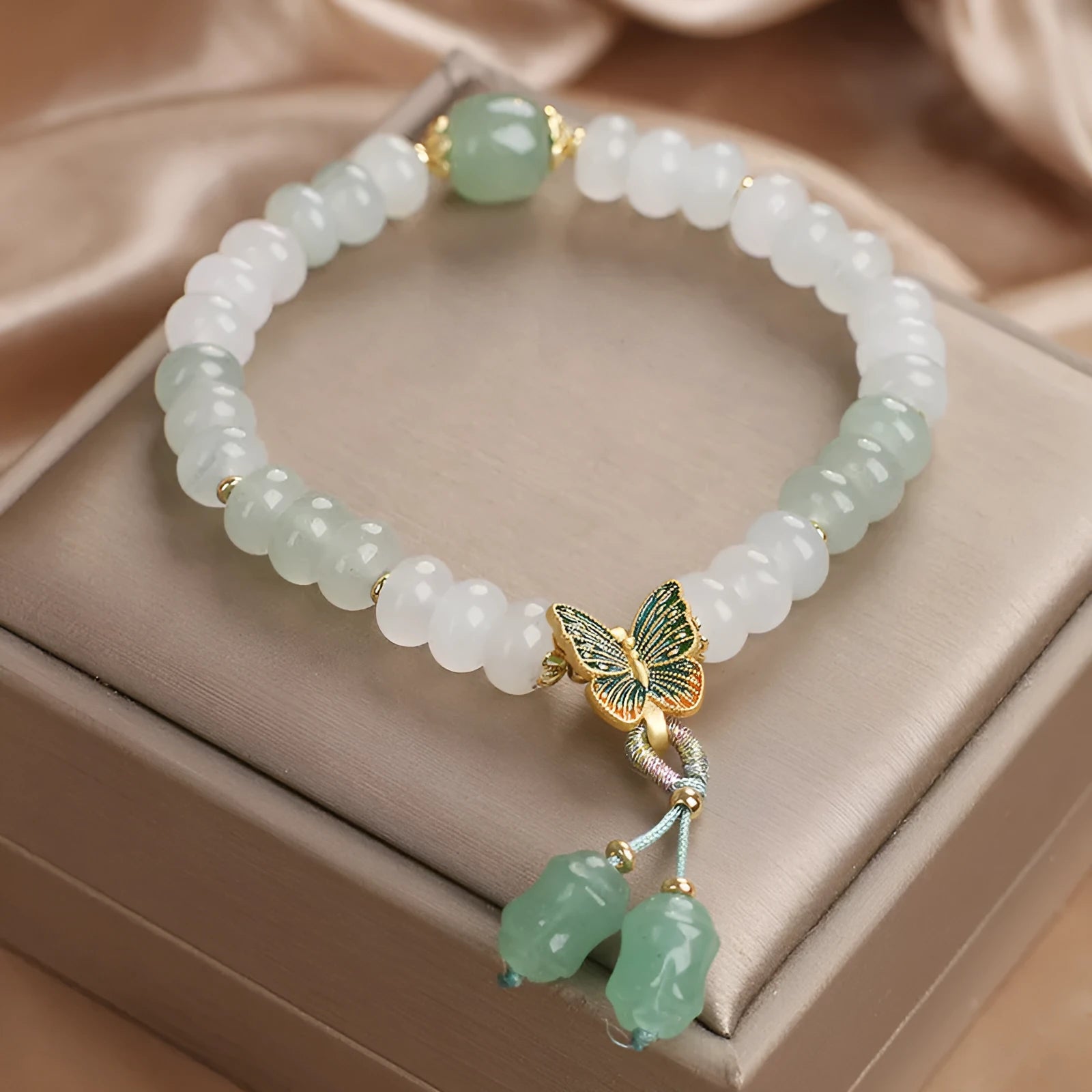 Green Tian Shan Cui abacus bead bracelet with crystal construction and butterfly tassel charms