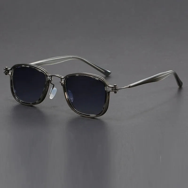 Retro square sunglasses with graphic lightning bolt design on black and gold frames.
