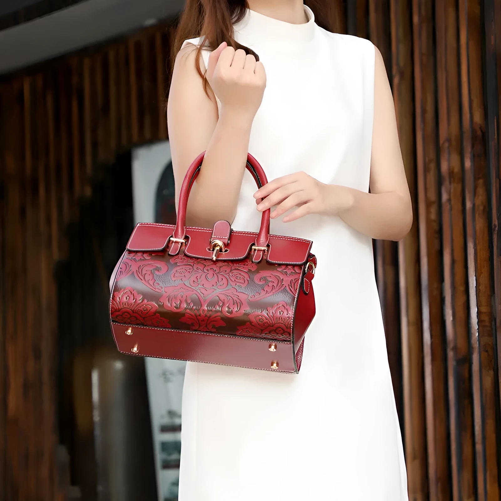 Women's vintage leather crossbody bag in red with embossing and multiple internal compartments