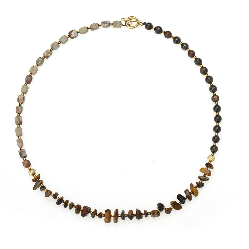 Tigereye stone and bronze geometric bracelet with glow ball design and texture details