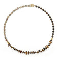 Tigereye stone and bronze geometric bracelet with glow ball design and texture details