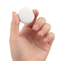 White and black GPS tracker for pets and keys with hanging rope attachment