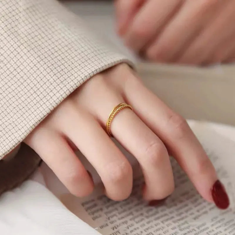 Brass gold plated women's ring shown in twist, glossy, and matte simple bracelet styles.