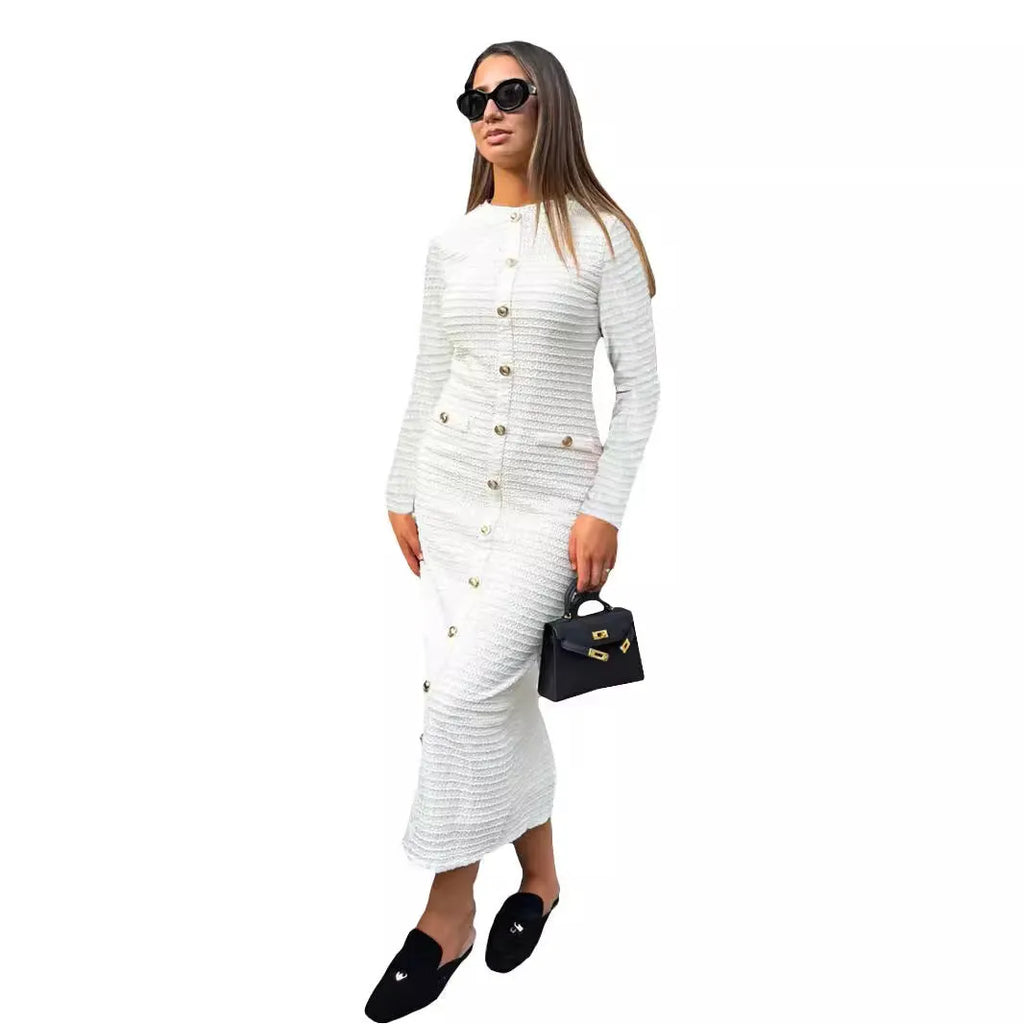 Black slim fit French retro knitted long sleeve dress with button detail on mannequin.