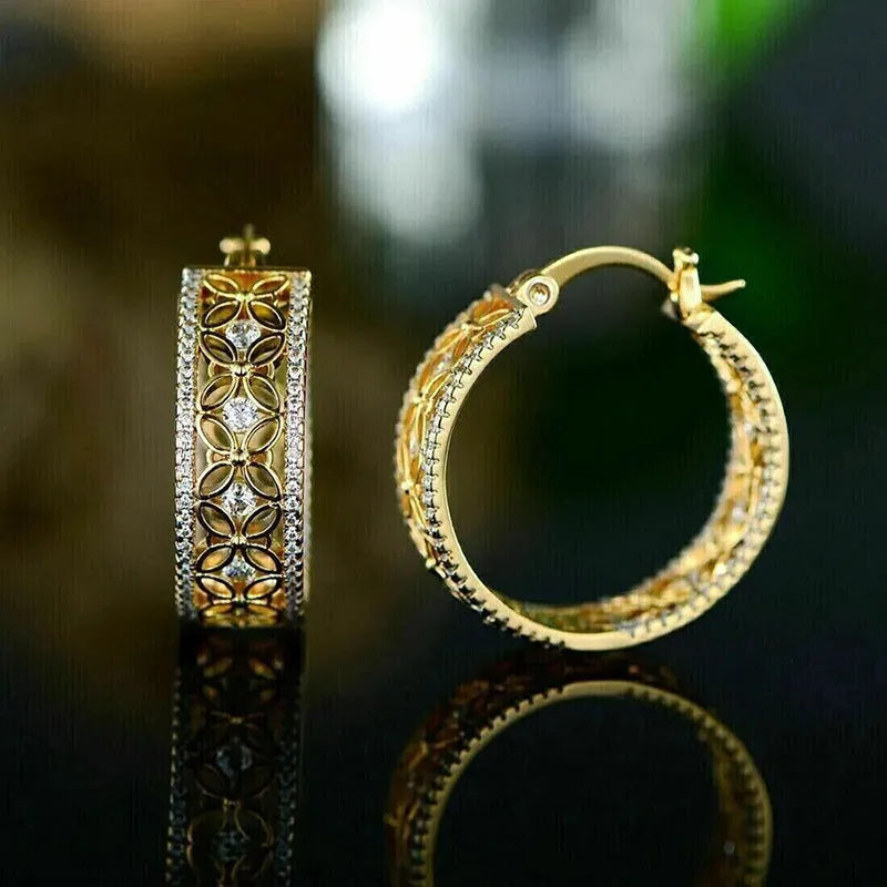 Geometric butterfly clip earrings with horse eye flower detail in yellow gold tone