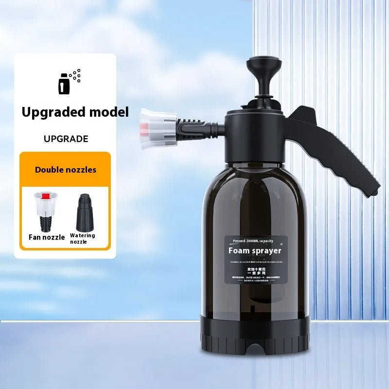 Black hand-held pressure sprayer with 2-litre capacity and two nozzles for garden and car cleaning