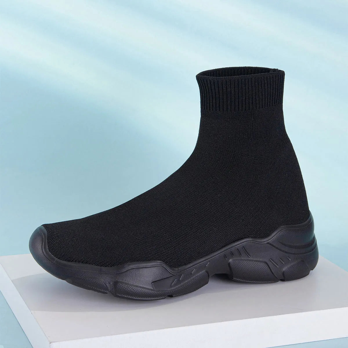 Thick-soled slip-on casual shoes in black with fabric upper and round toe