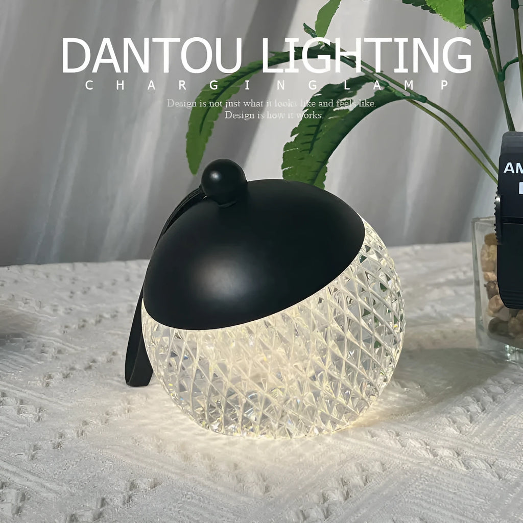 Small cylindrical portable LED night lamp with a touch dimmer in a choice of five colours.
