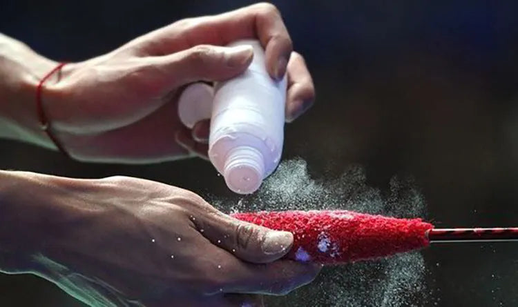 White sports anti-slip magnesium carbonate powder in container for gym and racket sports.